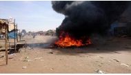 A bonfire is lit along the street during protests against price increases in Atbara, Nile River state in northeastern Sudan December 20, 2018. REUTERS/El Tayeb Siddig