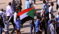 Sudanese demonstrators chant slogans as they march along the street during anti-government protests in Khartoum, Sudan December 25, 2018. REUTERS/Mohamed Nureldin Abdallah