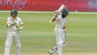 South Africa's Hashim Amla reacts after scoring his fifty runs during day three of the 1st cricket test match between South Africa and Pakistan at SuperSport Park cricket stadium on December 28, 2018 in Pretoria. (AFP / Christiaan Kotze)
