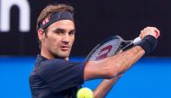 Roger Federer of Switzerland hits a return against Cameron Norrie of Britain during their fourth session men's singles match on day two of the Hopman Cup tennis tournament in Perth on December 30, 2018. AFP / TONY ASHBY