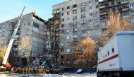 Emergency officers as they gather after a gas explosion rocked a residential building in Russia's Urals city of Magnitogorsk. AFP PHOTO 