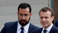 FILE PHOTO: French President Emmanuel Macron and his then senior security officer Alexandre Benalla arrive at an elementary school to attend a one-hour interview with French news channel TF1, in Berd'huis, France, April 12, 2018. Picture taken April 12, 2