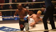 US boxing legend Floyd Mayweather Jr (L) knocks down Kickboxer Tenshin Nasukawa of Japan (C) during their exhibition match at Saitama Super Arena in Saitama on December 31, 2018. (AFP / Toshifumi KITAMURA)