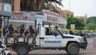 FILE PHOTO: Security forces deploy to secure the area after an overnight attack on a restaurant in the Burkina Faso capital Ouagadougou, August 14, 2017. REUTERS/Hamany Daniex