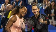 Serena Williams of the US (L) and Roger Federer of Switzerland (R) take a selfie after winning their mixed doubles match on day four of the Hopman Cup tennis tournament in Perth January 1, 2019.  AFP / TONY ASHBY