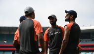 India's captain Virat Kohli (R) talks to teammates before a training session ahead of the fourth and final Test against Australia at the Sydney Cricket Ground in Sydney on January 2, 2019. AFP / Peter PARKS 