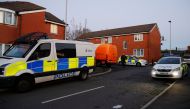 Police vehicles are seen near a house being searched in connection to a stabbing at Victoria Station in Manchester, Britain, January 1, 2019. REUTERS/Phil Noble