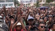 Supporters of the Malagasy opposition presidential candidate Marc Ravalomanana gesture and chant slogans during a rally at 13 Mai Plaza, in Antananarivo, on December 29, 2018. AFP / RIJASOLO