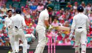 India's Kuldeep Yadav (L) celebrates with teammates after dismissing Australia's captain Tim Paine (C) during the third day's play of the fourth and final cricket Test between India and Australia at the Sydney Cricket Ground on January 5, 2019. (AFP / DAV