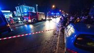 Police and firefighters stand in front of a place, where a fire that broke out in an escape room killed five teenage girls, in the northern Polish city of Koszalin on January 4, 2019. Poland OUT / AFP / REPORTER / Radoslaw Kolesnik
