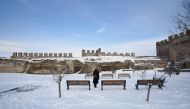 A woman visits the Byzantine-era Heptapyrgion castle following snowfall in Thessaloniki, Greece, January 5, 2019. REUTERS/Alexandros Avramidis