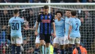 Manchester City's Leroy Sane celebrates scoring their seventh goal with team mates as Rotherham United's Joe Mattock looks dejected REUTERS/Jon Super
