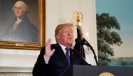FILE PHOTO: U.S. President Donald Trump announces military strikes on Syria while delivering a statement from the White House in Washington, U.S., April 13, 2018. REUTERS/Yuri Gripas/File Photo