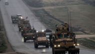 In this file photo taken on December 30, 2018 a convoy of US military vehicles rides in Syria's northern city of Manbij. (AFP / Delil SOULEIMAN)