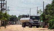 Anti-riot police stands on a truckload engaging in running battles with protestors in Emakhandeni township, Bulawayo, Zimbabwe on January 15, 2019. AFP / ZINYANGE AUNTONY
