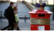 People walk past an ornate Royal Mail post box in Liverpool in 2016. (Phil Noble/Reuters)
