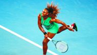 Serena Williams of the US serves against Canada's Eugenie Bouchard during their women's singles match on day four of the Australian Open tennis tournament in Melbourne on January 17, 2019. AFP / David Gray
