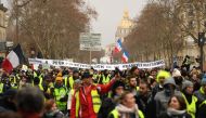 Protesters hold a banner reading 