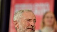 Britain's opposition Labour party leader Jeremy Corbyn winks to a colleague as he attends a political rally event in Hastings, southeast England on January 17, 2019. AFP / Ben STANSALL