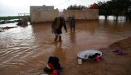 An Iraqi man walks near his home after heavy rainfall on the outskirt of Najaf, Iraq January 28, 2019. REUTERS/Alaa Al-Marjani