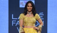 Indian badminton player Saina Nehwal showcases a creation by designer Vaani Ragupathy at the Lakmé Fashion Week (LFW) Summer Resort 2019, in Mumbai on February 2, 2019. / AFP / STR 