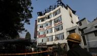 A fireman stands outside the hotel where a fire broke out in New Delhi, India, February 12, 2019. REUTERS/Anushree Fadnavis