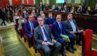 Former Catalan separatist leaders including (from front row R-L) Oriol Junqueras, Raul Romeva, Joaquim Forn, Jordi Sanchez, Jordi Turull, Josep Rull, Jordi Cuixart, Carme Forcadell, Dolors Bassa, Carles Mundo, Santi Vila and Meritxel Borras attend their t