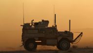 A military vehicle with the US-backed Syrian Democratic Forces (SDF) rides during an operation to expel Islamic State group (IS) jihadists from the Baghouz area in the eastern Syrian province of Deir Ezzor on February 13, 2019. (AFP / Delil souleiman)