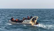 British rescuers helping some 20 migrants on a semi-rigid boat trying make their way from France across the English Channel  on February 18, 2019.  AFP/Societe Nationale de Sauvetage en Mer