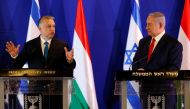 Hungarian Prime Minister Viktor Orban and Israeli Prime Minister Benjamin Netanyahu gesture as they speak to the media after their meeting in Jerusalem February 19, 2019. Ariel Schalit /Pool Via Reuters