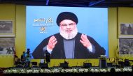 FILE PHOTO: Lebanon's Hezbollah leader Sayyed Hassan Nasrallah gestures as he addresses his supporters via a screen in Beirut, Lebanon August 14, 2018. REUTERS/Aziz Taher/File Photo
