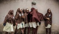 A group of girls leave their school during a rally by All Progressives Congress (APC) party supporters celebrating the re-election of the incumbent president and the leader of APC, in Kano on February 27, 2019.  AFP / Luis Tato 
 
