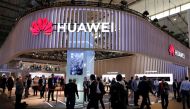 Visitors walk next to Huawei booth at the Mobile World Congress in Barcelona, Spain, February 27, 2019. Reuters/Rafael Marchante
