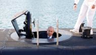 Israeli Prime Minister Benjamin Netanyahu climbs out after a visit inside the Rahav the fifth submarine in the fleet after it arrived in the Haifa port, January 12, 2016. Reuters/Baz Ratner