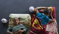 Mohammed Usman (L) and Alam Shah, two Rohingyan students take a nap during the afternoon break at religious school run by a Rohingya NGO, Majlis Ulama Rohingya in Selangor, Malaysia on February 19, 2019. (Adli Ghazali/Anadolu Agency)