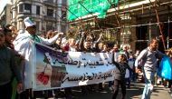 Algerians shout slogans and march with banners as they protest during a rally against ailing President Abdelaziz Bouteflika's bid for a fifth term in power, in the northern coastal city of Oran, about 410 kilometres west of the capital Algiers, on March 1