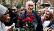 Britain's opposition Labour Party leader, Jeremy Corbyn, is greeted by young women and red roses during a visit to Finsbury Park Mosque, on Visit My Mosque day, in London, Britain, March 3, 2019. Reuters/Peter Nicholls