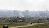 Plumes of smoke rise in Baghouz, Deir Al Zor province, Syria March 3, 2019. REUTERS/Rodi Said