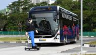 A Volvo AB 7300 electric autonomous bus drives on the track of Centre of Excellence for Testing & Research of Autonomous Vehicles after being unveiled in Singapore on March 5, 2019. AFP / Roslan Rahman 