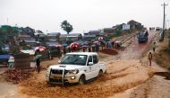 A car moves on the road through the rainwater in the Balukhali refugee camp in Cox's Bazar, Bangladesh, March 6, 2019. Reuters/Mohammad Ponir Hossain