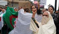 People protest against Algeria's President Abdelaziz Bouteflika, in Algiers, Algeria March 8, 2019. The sign reads: 