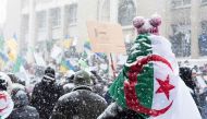 Algerian community protesters gather in Montreal, on March 10, 2019, to demonstrate against the rule of President Abdelaziz Bouteflika, who seeks a fifth term as Algeria head of state after 20 years of power. / AFP / MARTIN OUELLET-DIOTTE