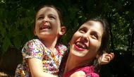 This handout picture released by the Free Nazanin campaign on August 23, 2018 shows Nazanin Zaghari-Ratcliffe (R) embracing her daughter Gabriella in Damavand, Iran following her release from prison for three days.  AFP/Free Nazanin Campaign