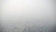 FILE PHOTO : Apartment complexes are seen shrouded by fine dust during a polluted day in Seoul, South Korea, March 6, 2019. REUTERS/Kim Hong-Ji/File Photo