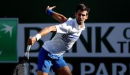 Novak Djokovic of Serbia returns a shot to Philipp Kohlschreiber of Germany during the BNP Paribas Open at the Indian Wells Tennis Garden on March 12, 2019 in Indian Wells, California. Matthew Stockman/Getty Images/AFP
