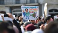 Algerian teachers and students protest in central Algiers on March 13, 2019 against President Abdelaziz Bouteflika's bid to prolong his two-decade rule. A thousand teachers started the protest in the morning before being joined by students, a teacher at t