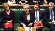 A handout photograph released by the UK Parliament on March 13, 2019 shows Britain's Prime Minister Theresa May responding to the result of a vote in the House of Commons in London on March 13, 2019 in which MPs signalled their opposition to leaving the E