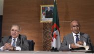 Newly appointed Algeria's prime minister Noureddine Bedoui (R) gives a joint press conference with his deputy Ramtane Lamamra in Algiers on March 14, 2019. AFP / RYAD KRAMDI