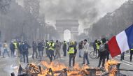 Yellow vests (Gilets jaunes) protesters setup a barricade with fire on the Champs-Elysees during the 18th consecutive Saturday national protest (Act XVIII demonstration) in Paris, France on March 16, 2019. Mustafa Yalç?n - Anadolu