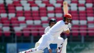 Afghanistan's Rahmat Shah plays a shot during day four of the Test cricket match between Afghanistan and Ireland at the Rajiv Gandhi International Cricket Stadium in the northern Indian city of Dehradun on March 18, 2019. AFP / Money Sharma 